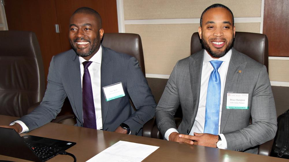 (From left): Joe Ayisi and Bruce Hampton, who are the CFO and managing partner of 5th Century Partners, respectively, meet with officials at the 2023 symposium.