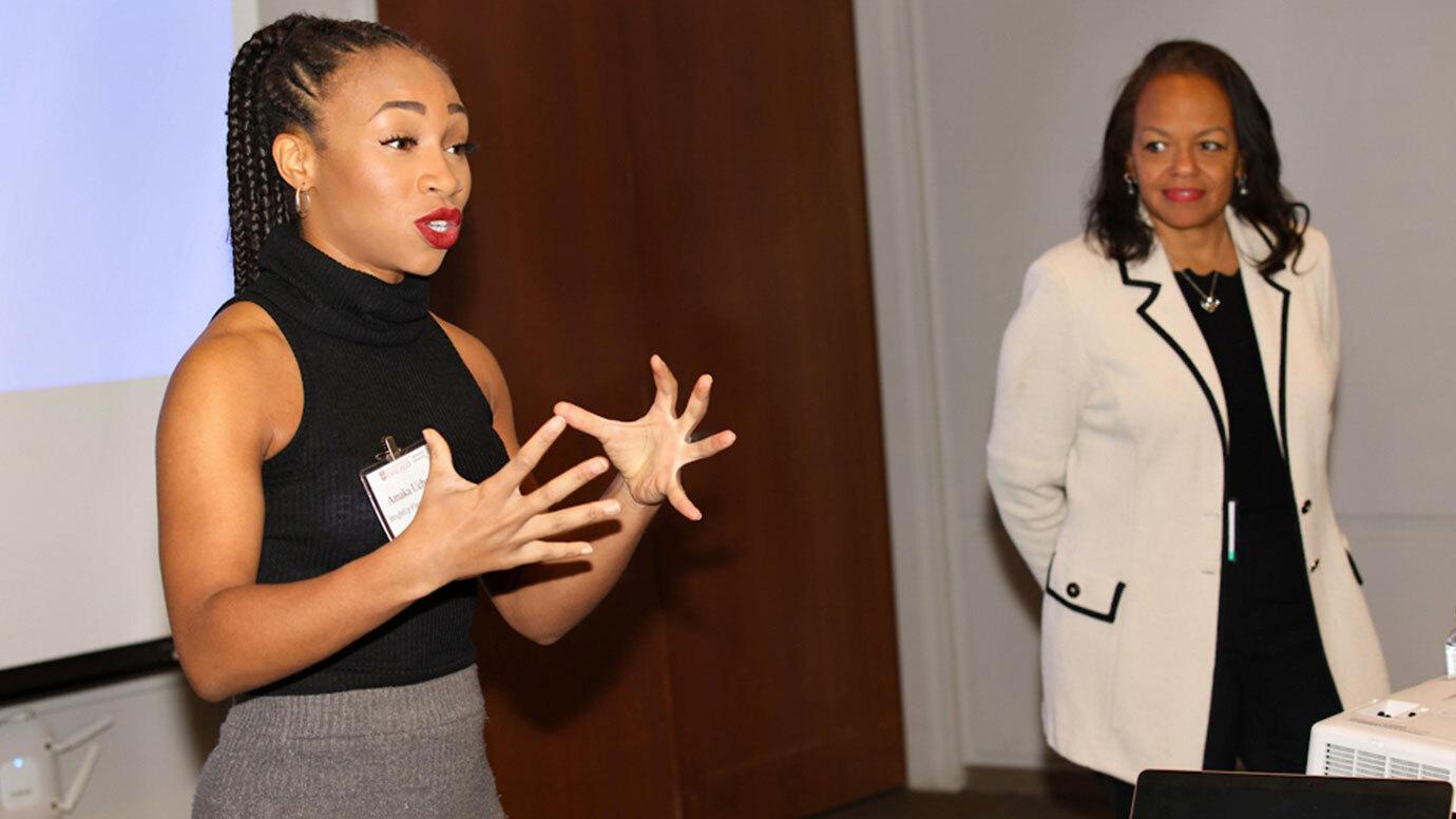 Amaka Uchegbu, left, of BrightUp Financial Wellness and Valerie Mosley, founder and chief visionary officer for BrightUp, speak at the University of Chicago’s annual Professional Services Symposium.